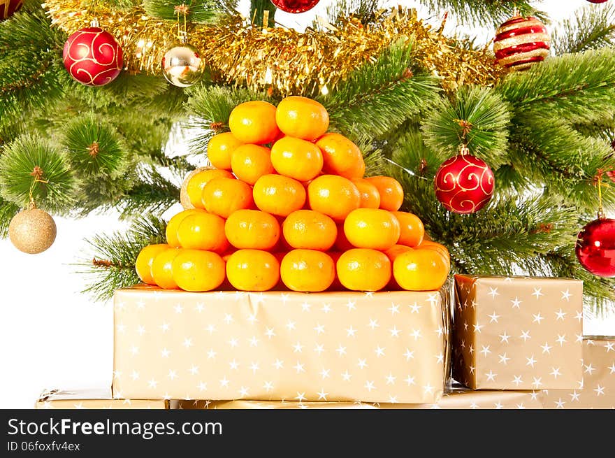 Christmas Tree With Gifts And Mandarines