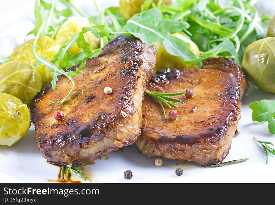 Grilled steaks and vegetables.