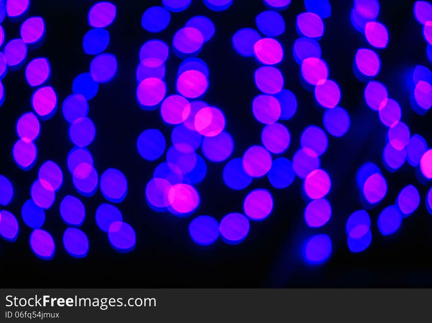 Abstract background of blurred lights with cool blue and purple background with bokeh effect. Abstract background of blurred lights with cool blue and purple background with bokeh effect