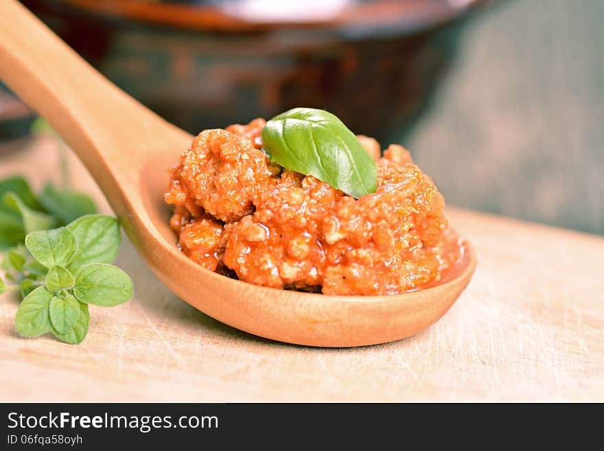 Ragu bolognese on a wooden spoon