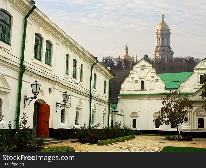 Yard of the orthodox monastery - view of church and belfry outside. Yard of the orthodox monastery - view of church and belfry outside