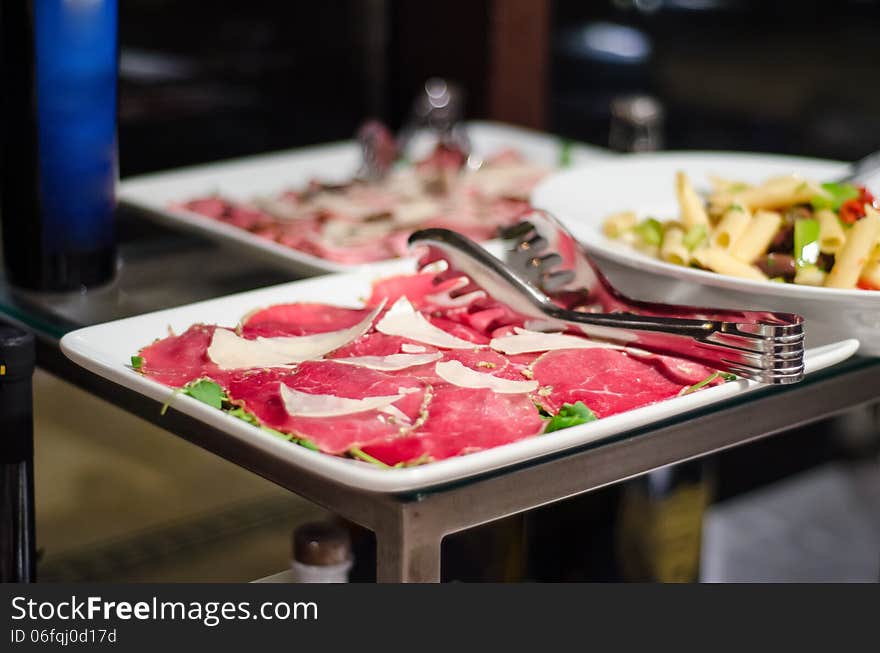 Raw beef carpaccio with parmiggiano