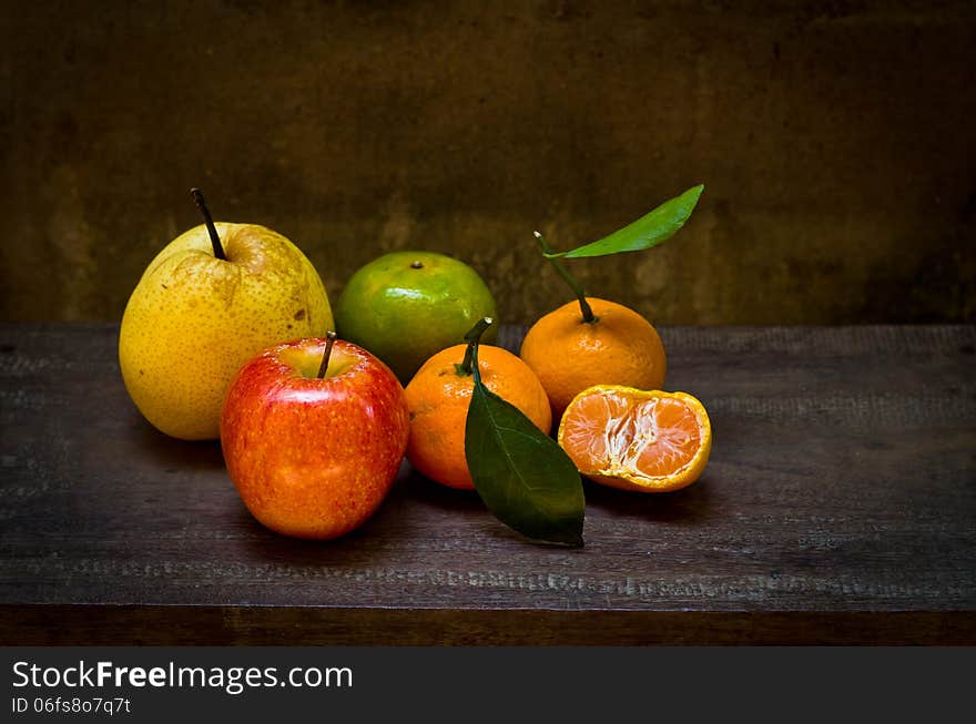 Fresh fruits on an old wood chair,still life