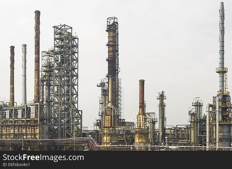 A part of an oil and gas refinery with various petrochemical installations. A part of an oil and gas refinery with various petrochemical installations