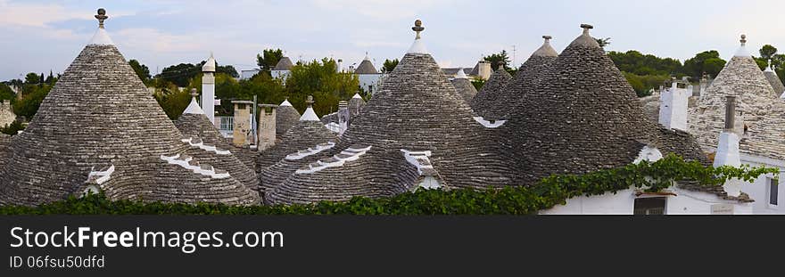 Panorama of Alberobello, Apulia (Italy). Trulli houses, dry-stone houses with conical roofs. From 1996 trulli houses of Alberobello are protected under UNESCO. Panorama of Alberobello, Apulia (Italy). Trulli houses, dry-stone houses with conical roofs. From 1996 trulli houses of Alberobello are protected under UNESCO