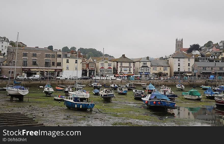 Low tide Brixham harbour Devon on overcast day