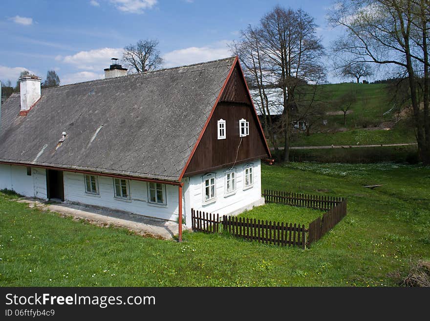 Wooden cottage with a small fence. Wooden cottage with a small fence