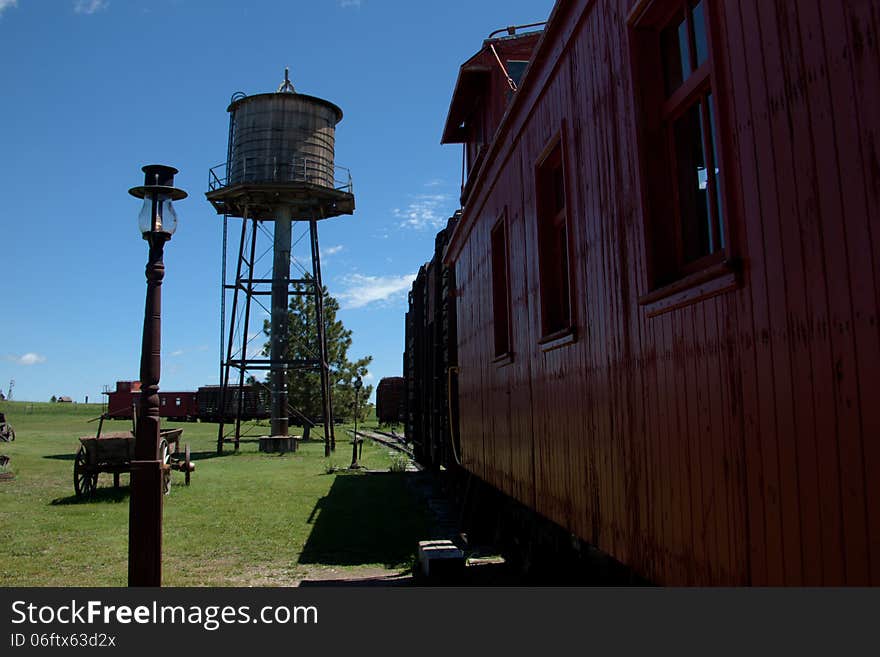 The side of a train and a water tower.