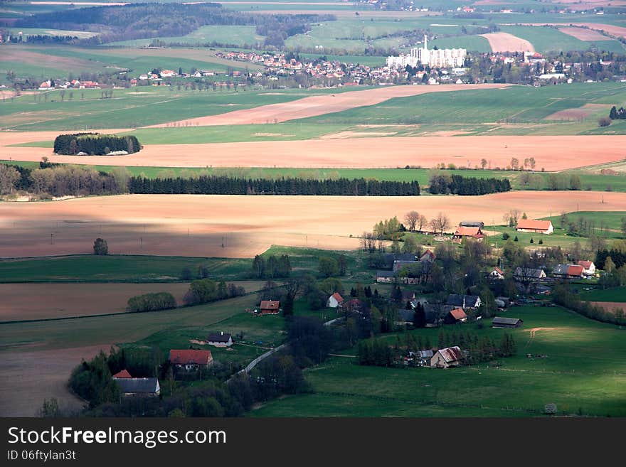 Agricultural landscape and village in the. Agricultural landscape and village in the