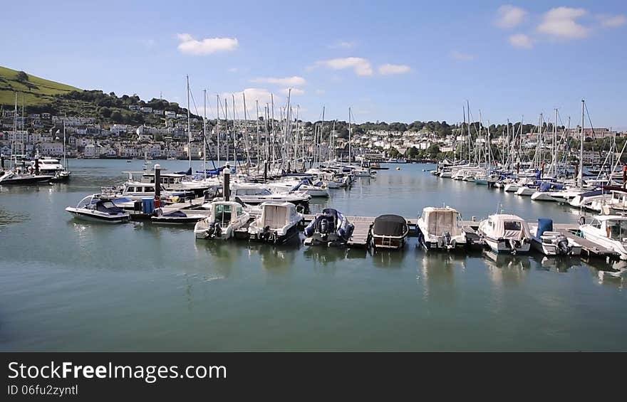 Dartmouth Devon England UK boats and yachts on the river and in he marina with blue sky in summer. Dartmouth Devon England UK boats and yachts on the river and in he marina with blue sky in summer