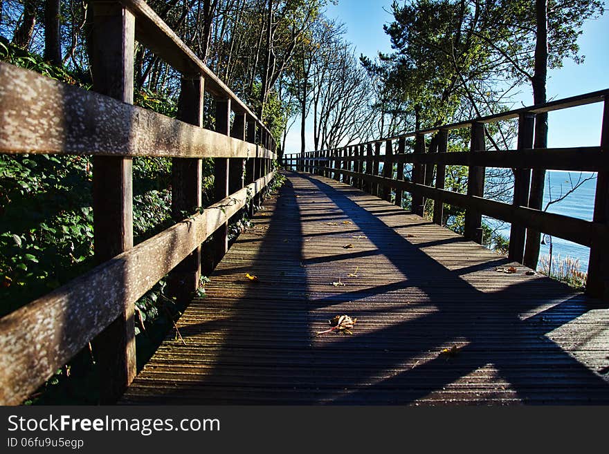 Low angle shot of the small wooden bridge at Langmoor-Lister Gardens. Low angle shot of the small wooden bridge at Langmoor-Lister Gardens