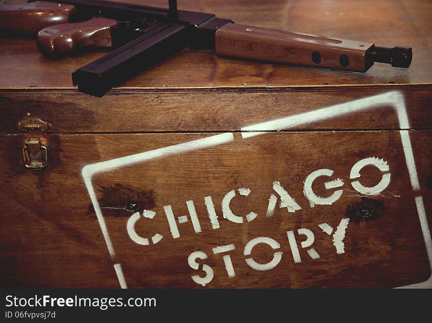 Wooden box with an inscription and a gun. Wooden box with an inscription and a gun