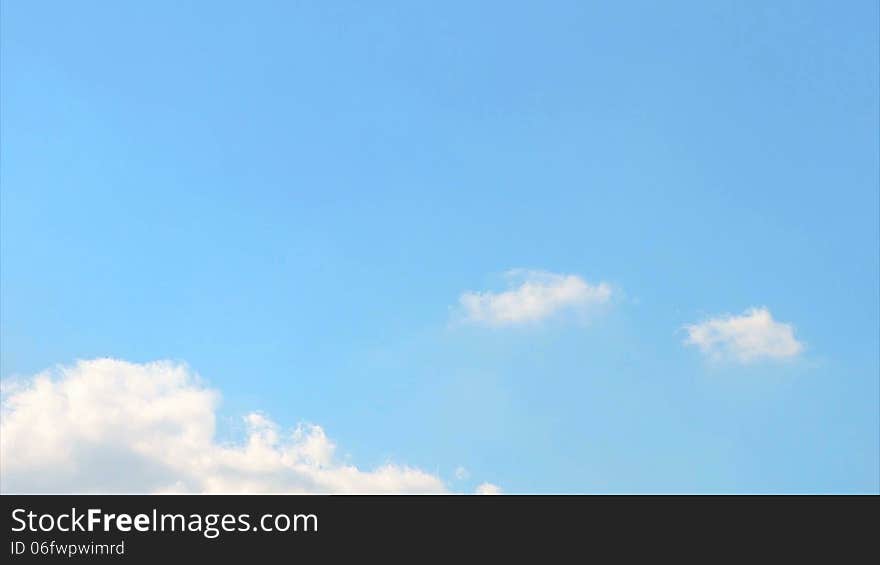 Fast moving white clouds in blue sky timelapse. Fast moving white clouds in blue sky timelapse.