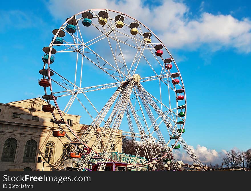 Carousel on a blue sky