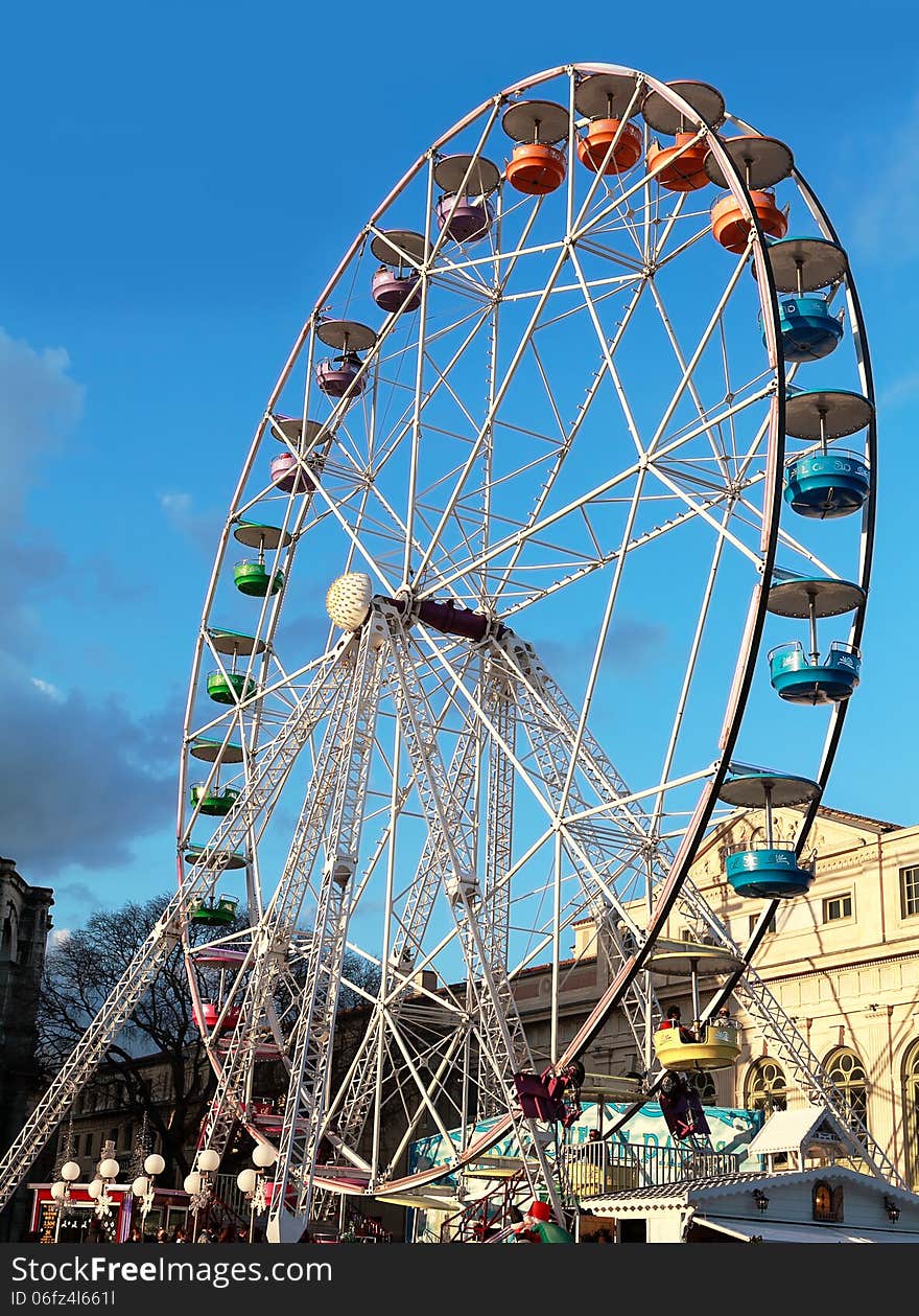 Carousel on a blue sky