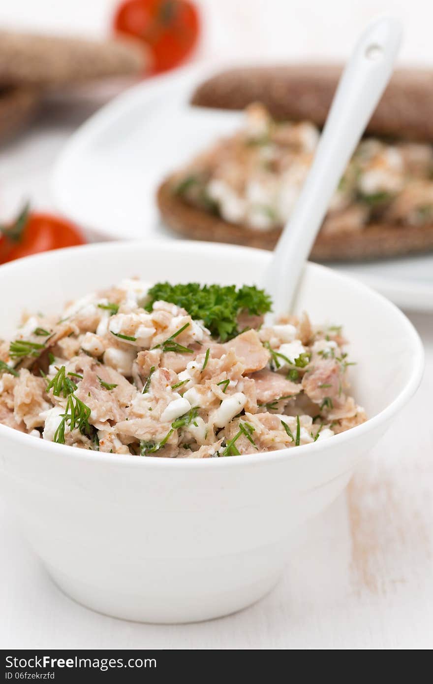 Pate with tuna, homemade cheese and dill in a bowl, vertical