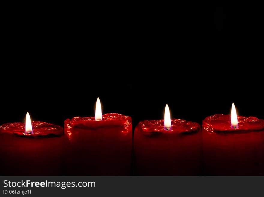 Detailed photo of red advent candles.