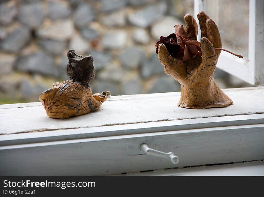 Cat a hand on the windowsill, decoration for window. Cat a hand on the windowsill, decoration for window