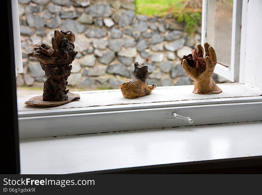 Decorations and ornaments from fired clay on the windowsill. Decorations and ornaments from fired clay on the windowsill