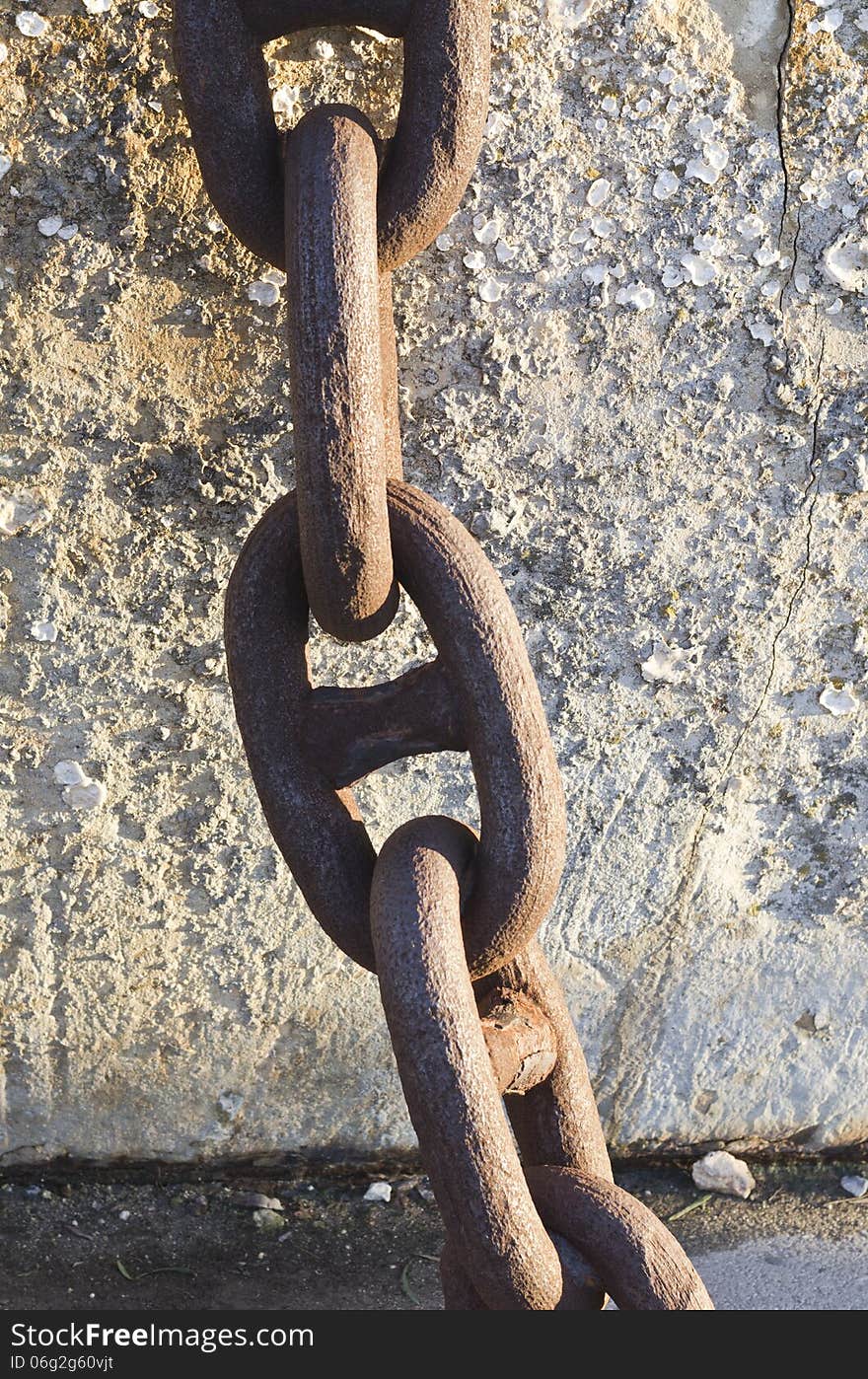 A close up view of a rusted metal chain