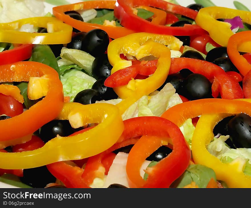 Freshly Prepared Garden Salad With Sliced Bell Peppers on Top