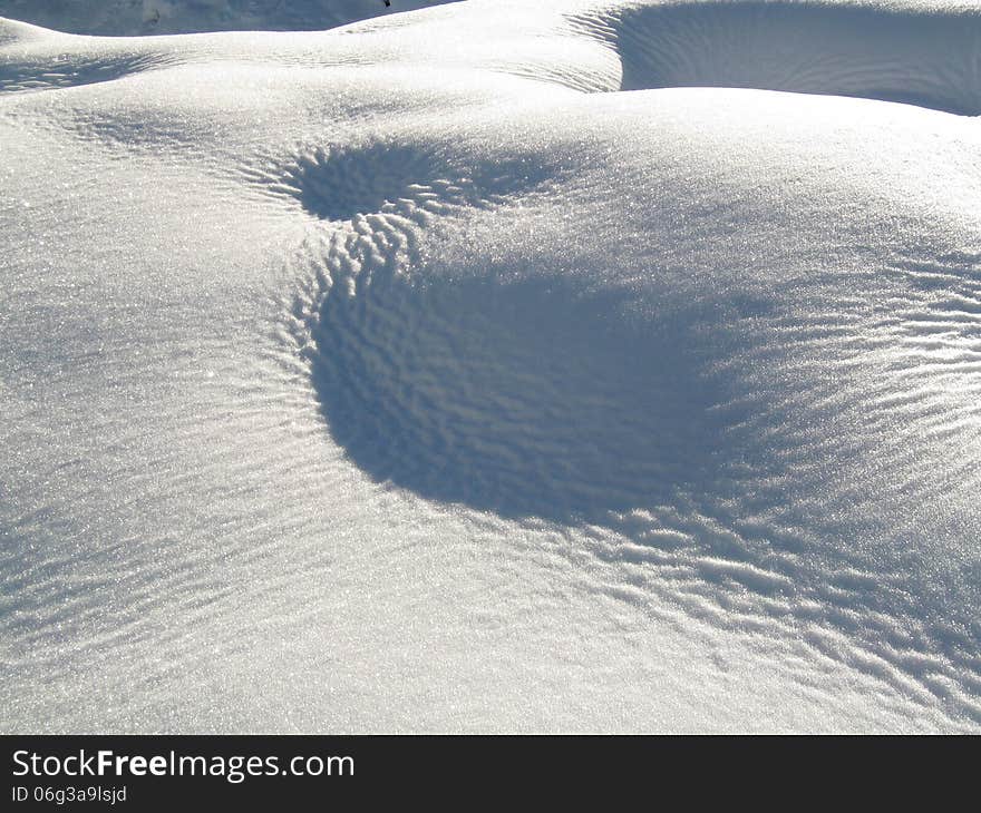 Snow in a winter mountain landscape. Snow in a winter mountain landscape