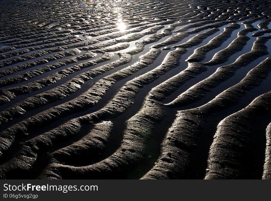 Texture formed by the sunset on the beach at Rodrigues Island