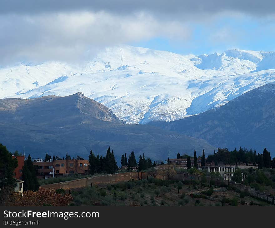 Skiers season starts in the Sierra Nevada with the first coat of autumn snow sending a chill down into the foothills and the city of Granada. Skiers season starts in the Sierra Nevada with the first coat of autumn snow sending a chill down into the foothills and the city of Granada