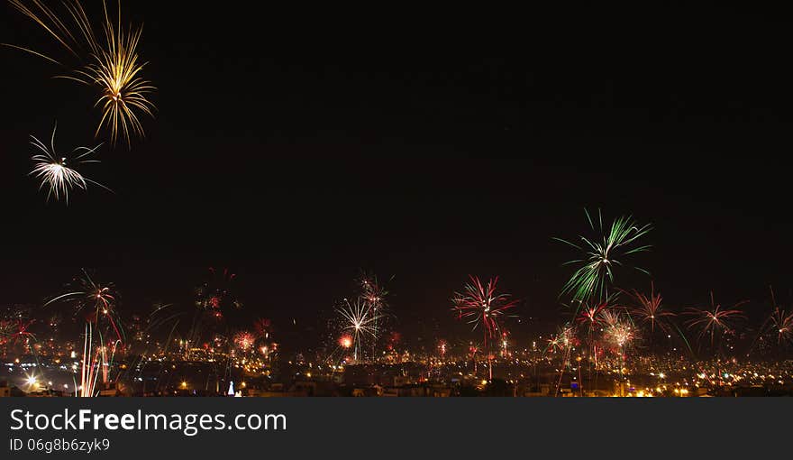 New year's eve fireworks in the city of Arequipa, Peru. Panorama with room for text. New year's eve fireworks in the city of Arequipa, Peru. Panorama with room for text