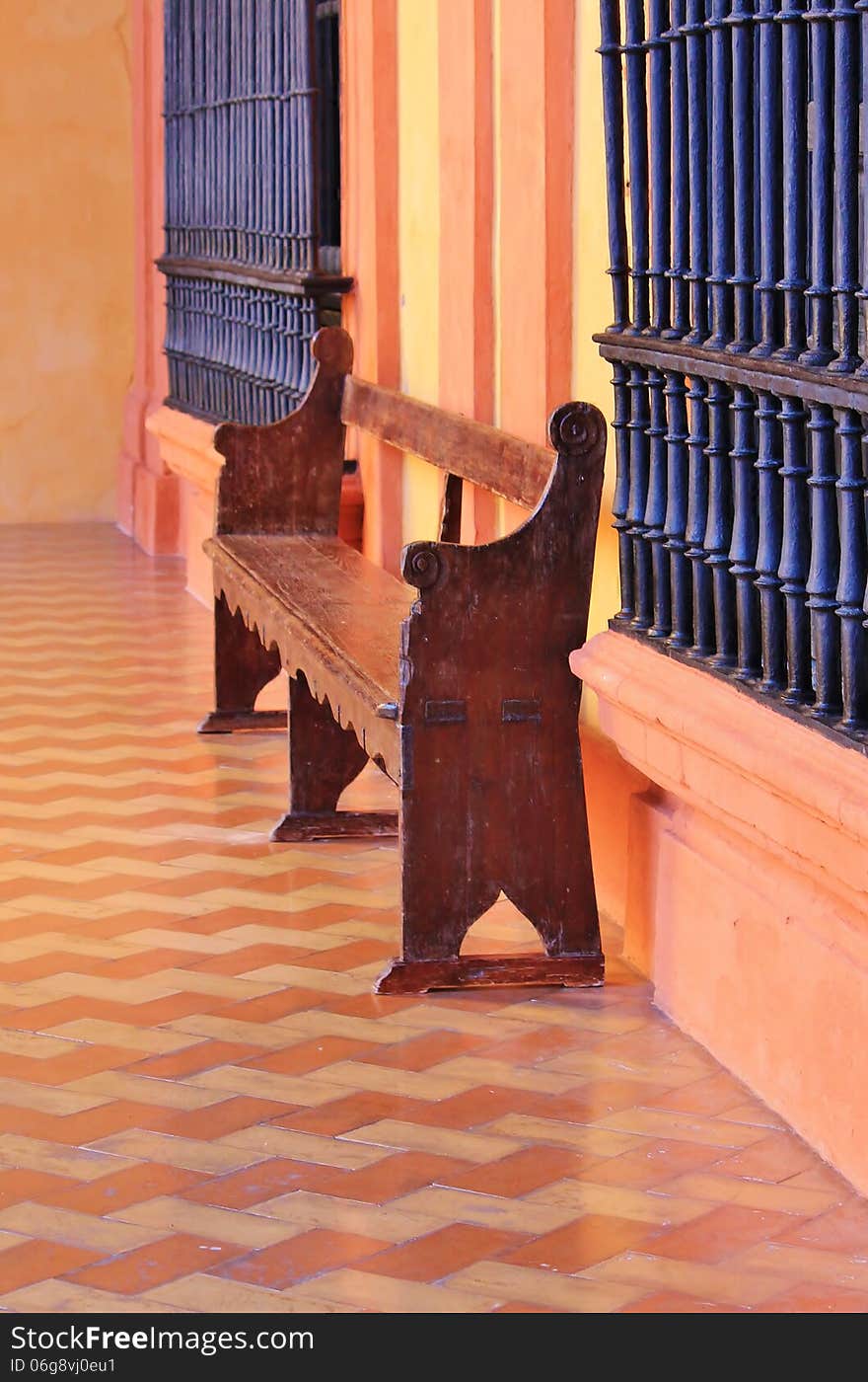 Bench with tiles and orange painted walls. Bench with tiles and orange painted walls