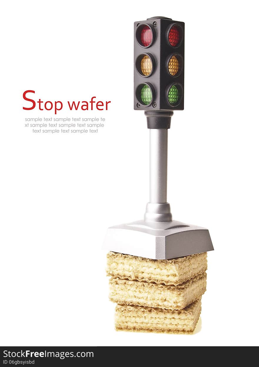 Small model traffic light on wafer stack isolated on white background. Small model traffic light on wafer stack isolated on white background