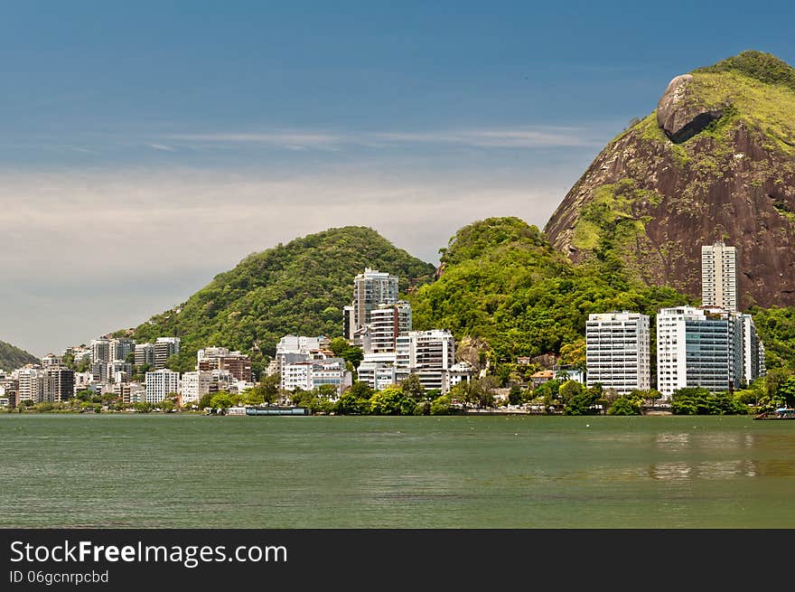 Residential Buildings and Mountains around Rodrigo de Freitas Lake in Rio de Janeiro, Brazil. Residential Buildings and Mountains around Rodrigo de Freitas Lake in Rio de Janeiro, Brazil