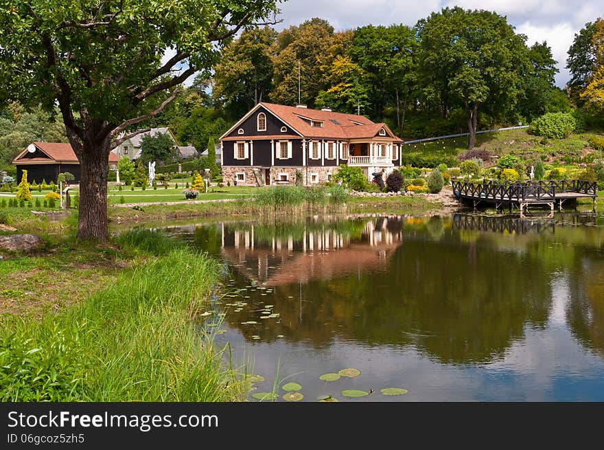 Big Family House in Front of the Lake in the Forest