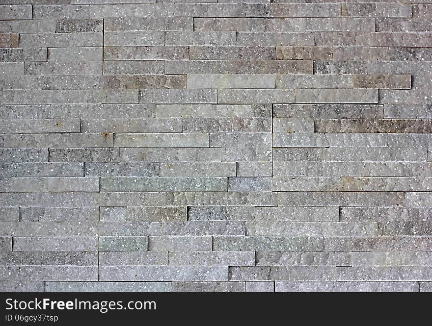 Wall built of granite blocks of white color