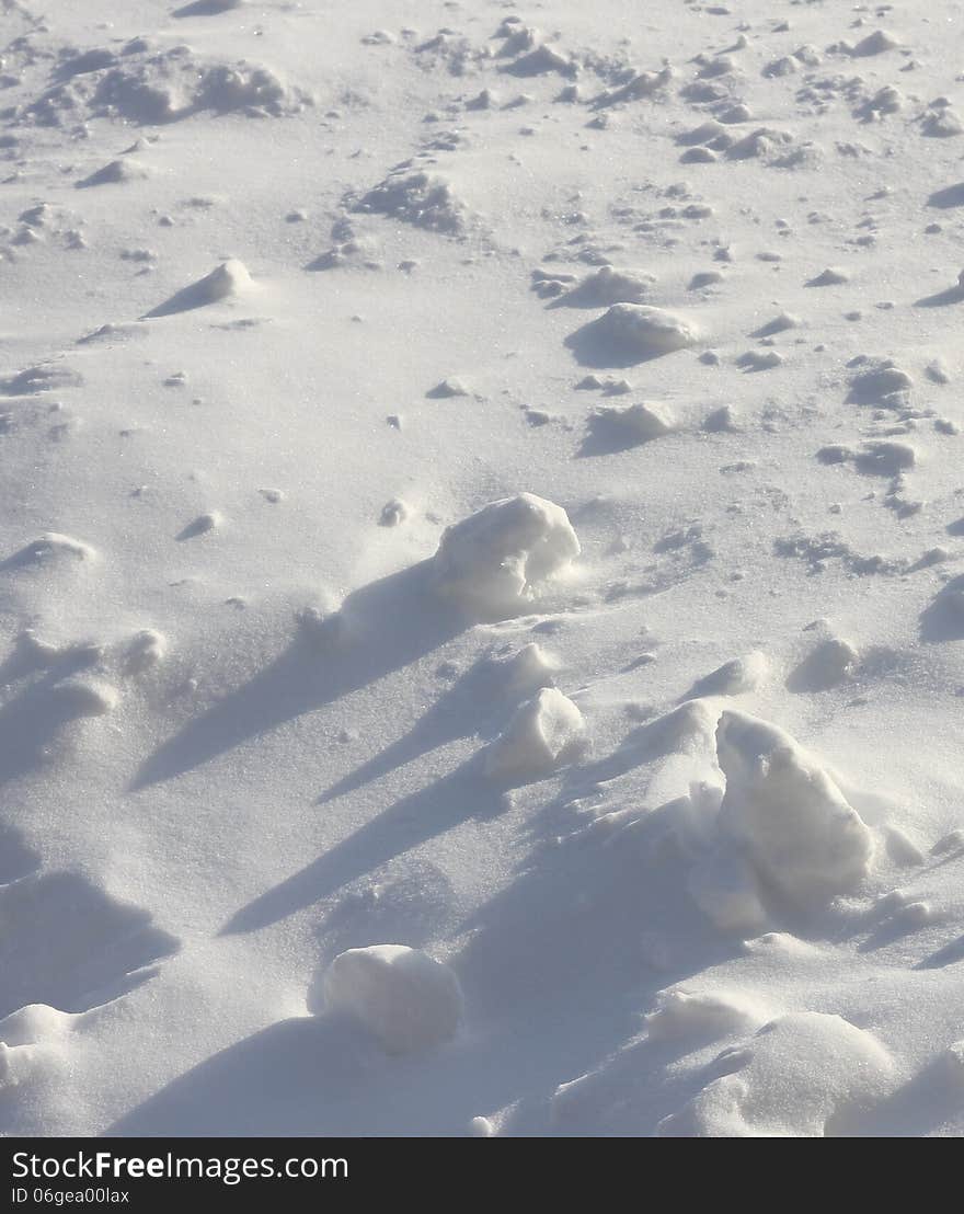 Fresh fallen snow with snowballs. Fresh fallen snow with snowballs