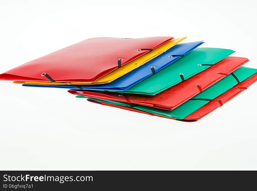 Colorful office folders on white background