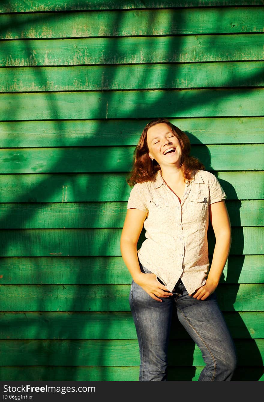 Young girl in the sunlight laughing. Young girl in the sunlight laughing