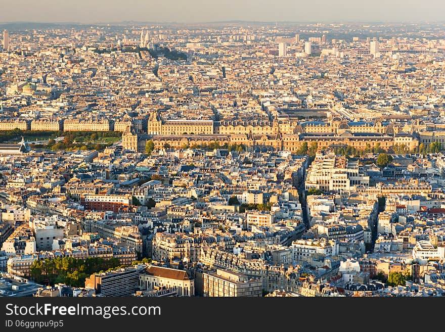 View of Paris from the Montparnasse Tower at sunset. Louvre in the center. View of Paris from the Montparnasse Tower at sunset. Louvre in the center.