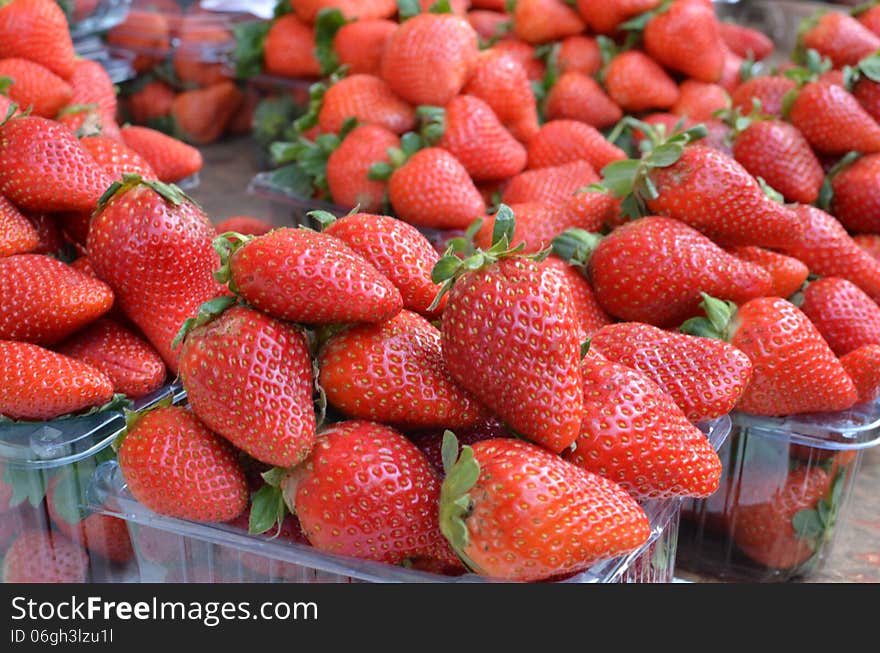 Market stand with fresh strawberries