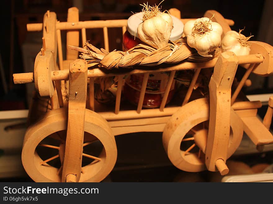 Wooden cart with garlic