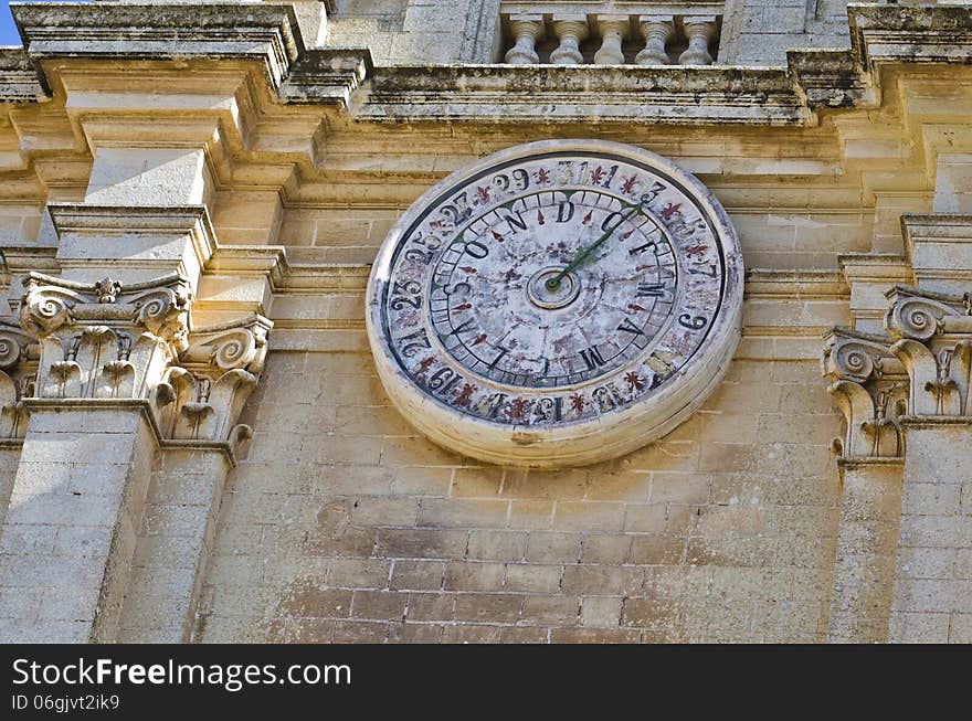 A calendar clock located on the facade of Cathedral is showing the day and date.