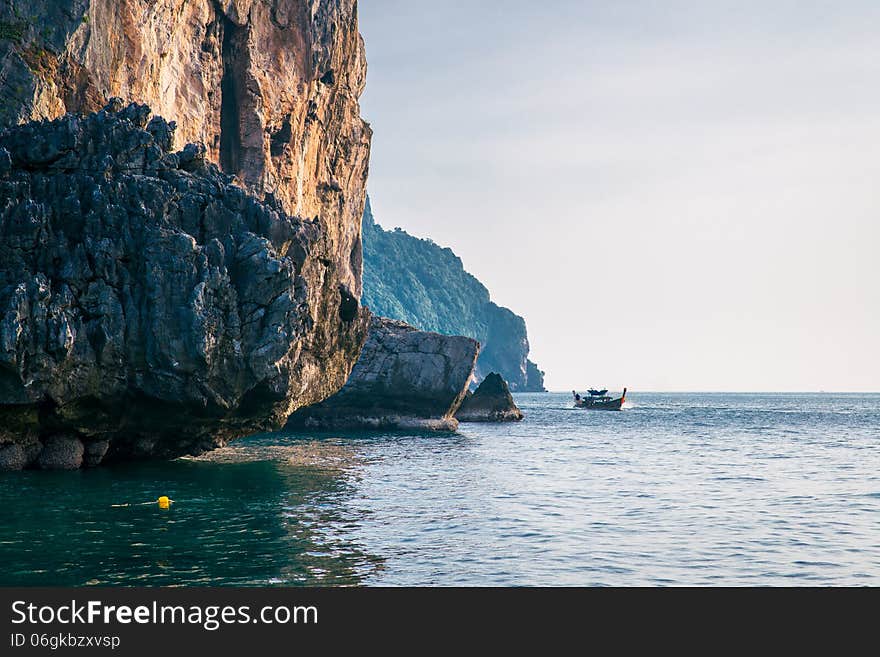 Landscape. sea, rocks and a boat in the morning