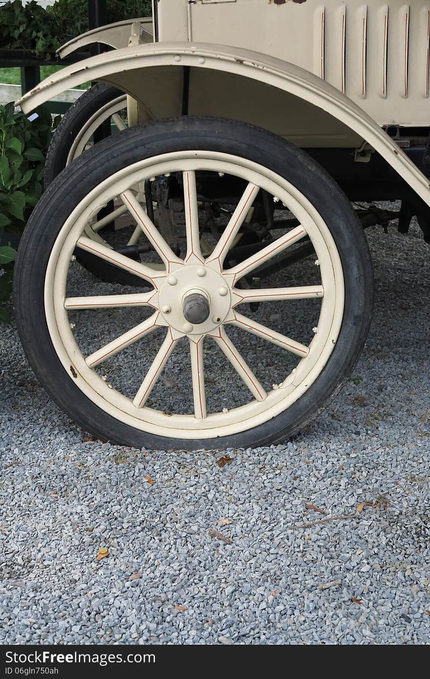 Antique truck wheel with spokes and fender. Antique truck wheel with spokes and fender.