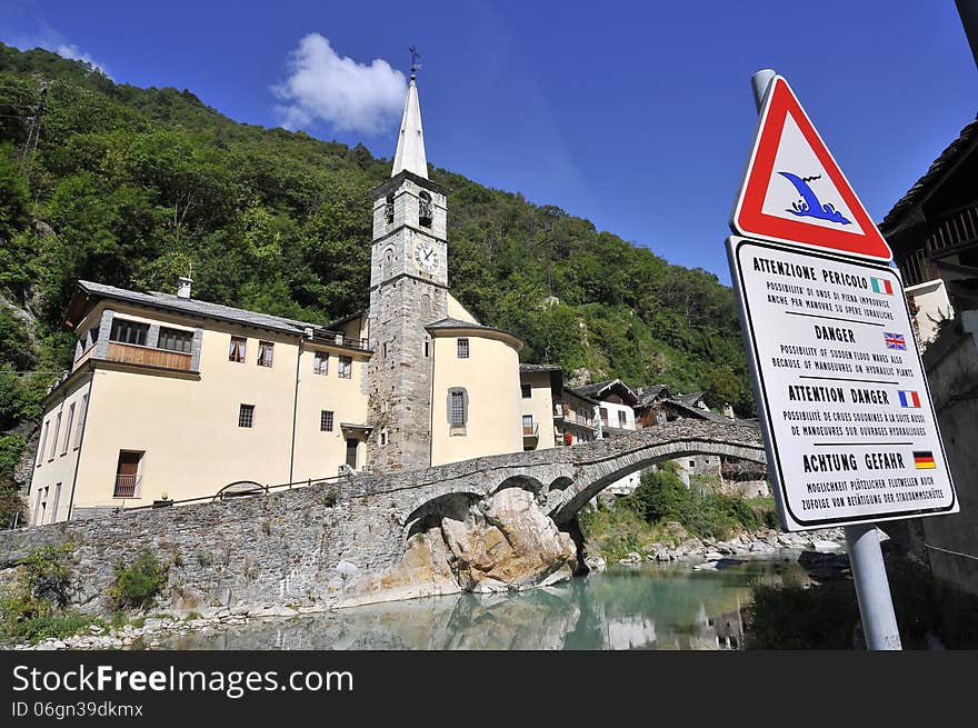 Roman bridge with church in Fontainemore, Aosta Valley, Italy