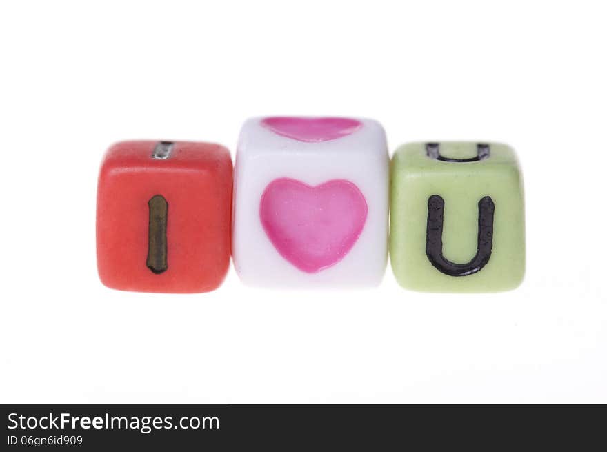 Colorful plastic cubes with I love you alphabets.