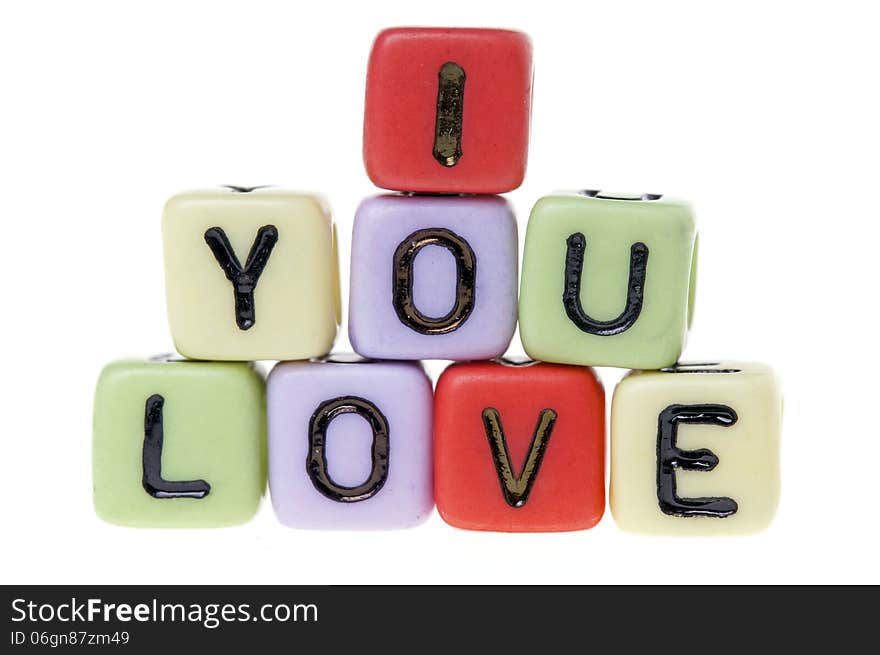 Colorful plastic cubes with I love you alphabets.