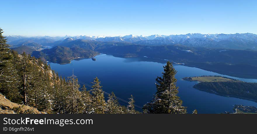 Lake Walchen as seen from Mount Herzogstand, Bavaria, with the Austrian Alps in the distance. Lake Walchen as seen from Mount Herzogstand, Bavaria, with the Austrian Alps in the distance.