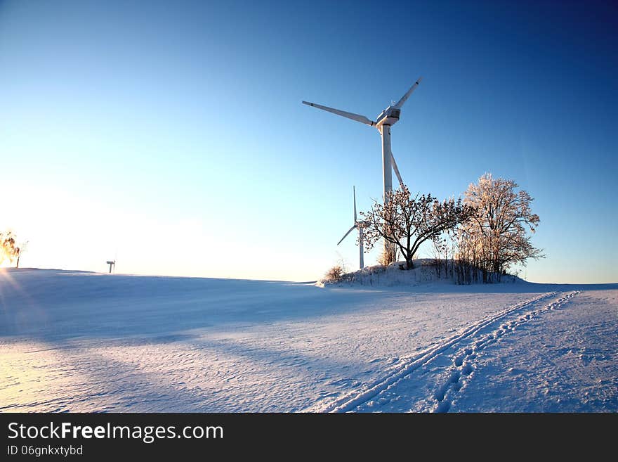 Wind turbines on snowy hill. Wind turbines on snowy hill