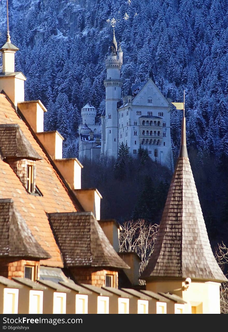 Neuschwanstein Castle, built by King Ludwig of Bavaria in the 1880s, as seen from Hohenschwangau Palace (Schloss Hohenschwangau).Hohenschwangau is the childhood residence of King Ludwig II of Bavaria and was built by his father, King Maximilian II of Bavaria. It is located in the German village of Hohenschwangau near the town of Fuessen in southwestern Bavaria, Germany, close to the border with Austria. Built on the ruins of an old castle the palace was constructed between 1833 and 1855.