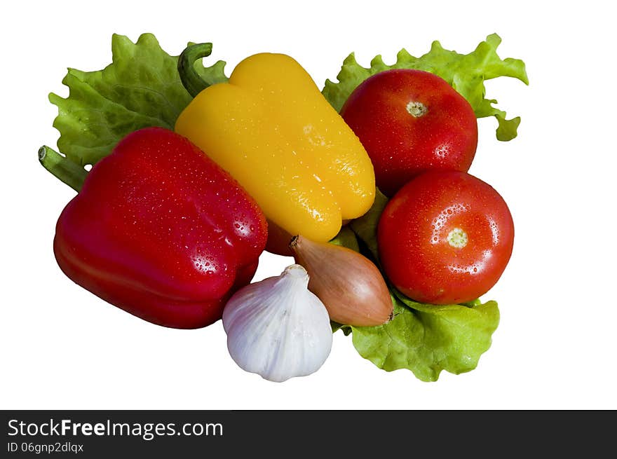 Fresh vegetables pepper, tomato, garlic, onions and green salad on a white background